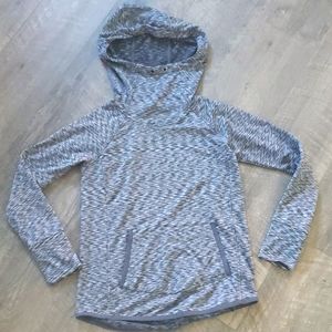 Fleece lined, high necked athletic sweatshirt.